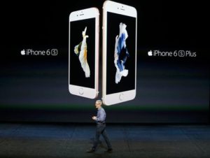 Tim Cook on stage in front of the new iPhones: 6s and 6s Plus.--via New York Times, Reuters.