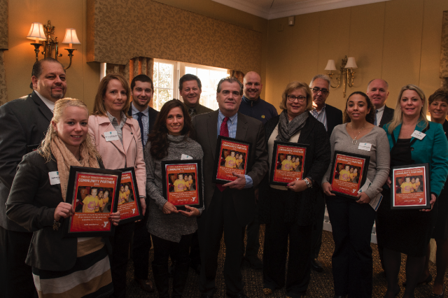 Gold level award recipients are joined by Denise Day, CEO of the YMCA of Greater Brandywine at the 2015 Community Partners Recognition Breakfast at the Penn Oaks Golf Club on December 4. 