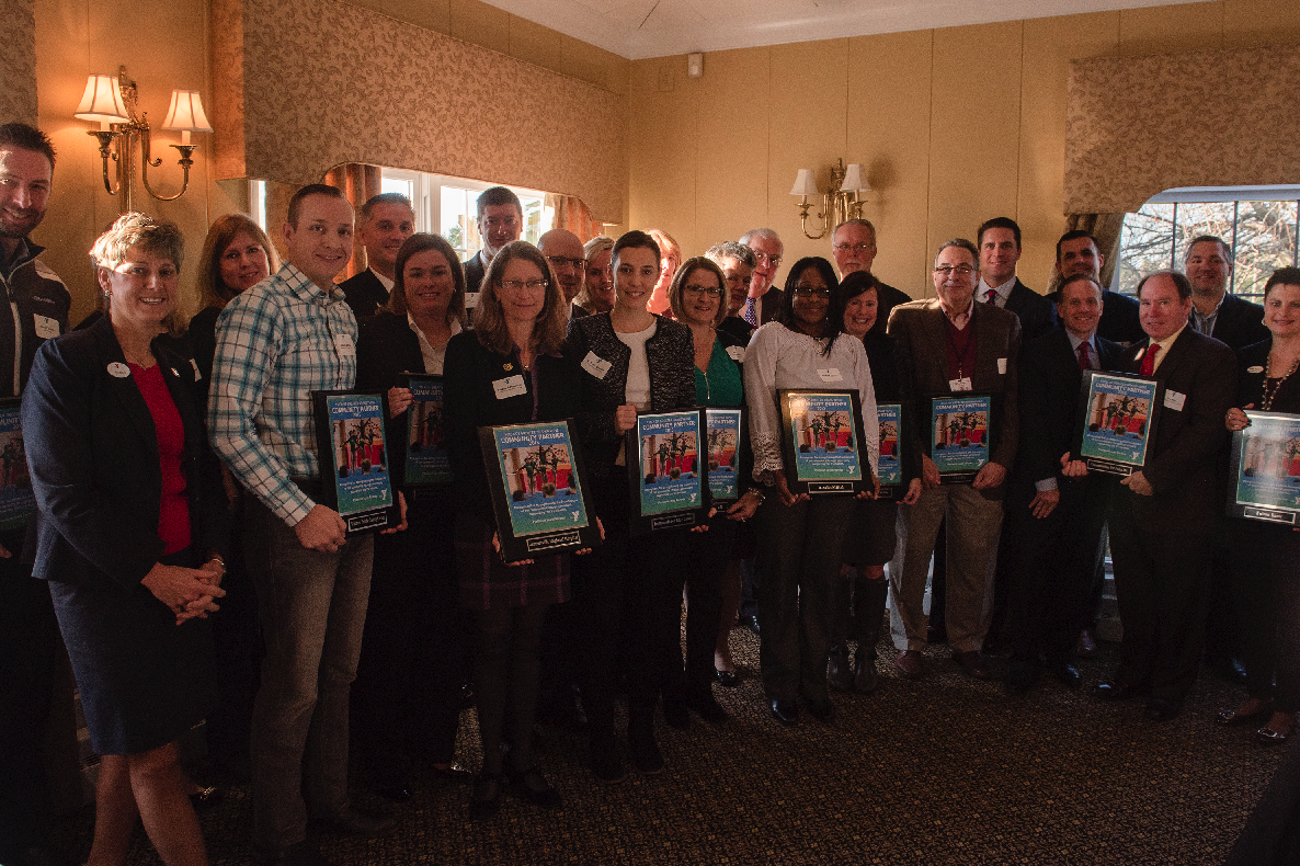 Platinum level award recipients are joined by Denise Day, CEO of the YMCA of Greater Brandywine at the 2015 Community Partners Recognition Breakfast at the Penn Oaks Golf Club on December 4. 