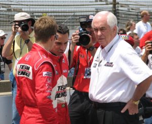 Racing legend Roger Penske (right) with his team beside the track.--via wikipedia.org