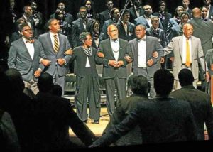 From the Daily Local: "The audience responded with joined hands as the speakers and chorus closed the program with the song, “We Shall Overcome.” From left are Lincoln Class of 2017 Brandon Stanard, Student Body President Terrell Smith, CeLillianne Green, Robert Moses, host Emmanuel Babatunde, Interim President Richard Green."