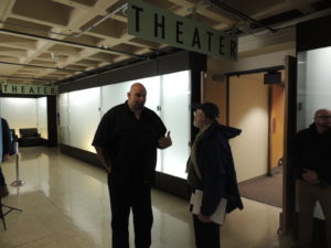 Mayor Fetterman speaks with a member of the audience after his speech on Wednesday.