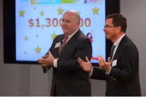 Bob Shope, board chair of the YMCA of Greater Brandywine, and Leo Parsons, president and COO of Communications Test Design, Inc. (CTDI), address the YMCA of Greater Brandywine’s staff, donors and board members, who will be volunteering with the Y’s annual campaign.