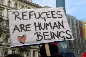 A sign in France declares the dignity of those seeking a better life--via Forbes.com
