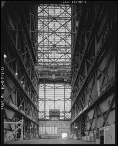 What's known as the "transfer aisle" isnde the Kennedy Space Center. Note the space rocket size opening at the end.--via Library of Congress.