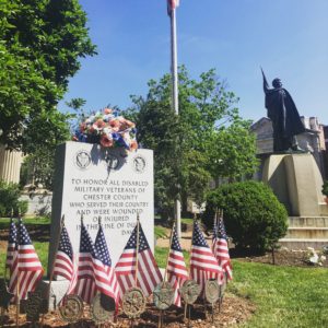 A memorial to veterans stands just west of 'Old Glory' in Downtown West Chester.