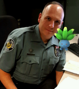 A West Chester Police Officer poses with a Pokemon.