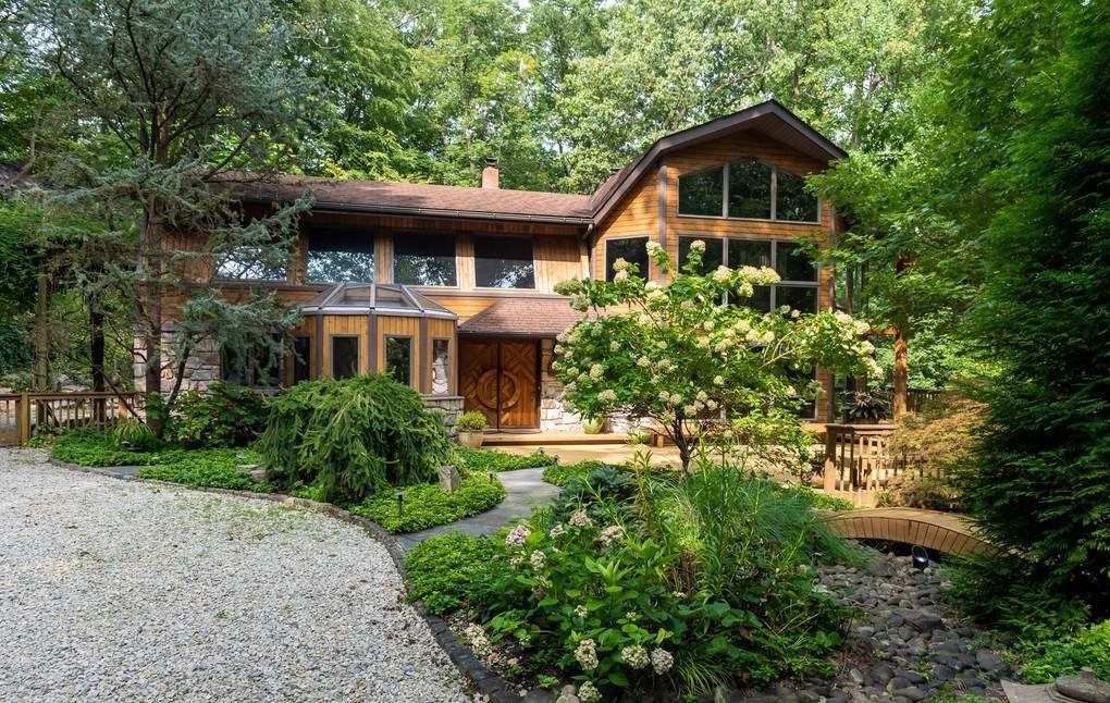 Malvern Bank House of the Week: Soaring Ceilings, Walls of Windows Amidst Nature in Phoenixville