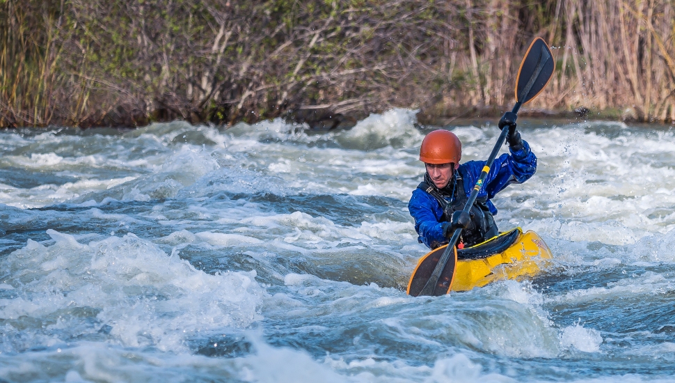 man whitewater kayaking