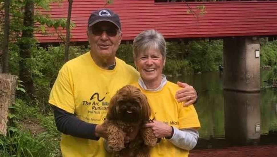 A man, woman and dog are shown participating in the May 16 Arc of Chester County virtual 1-mile Bubble Walk and 5k Run fundraiser
