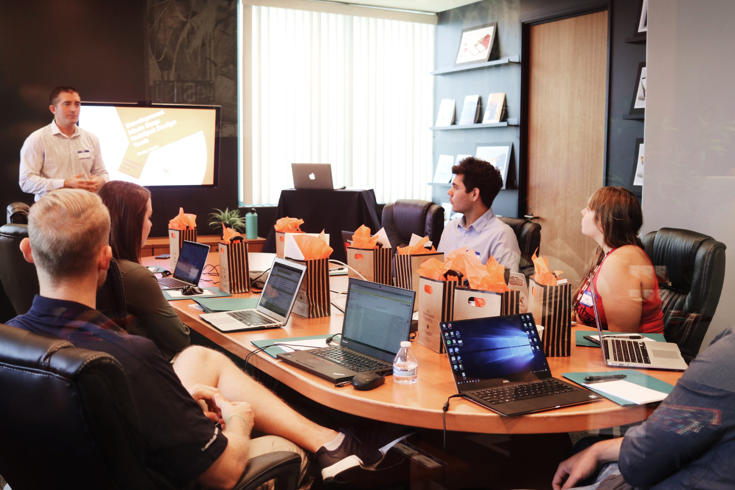 Leader training his team in a conference room