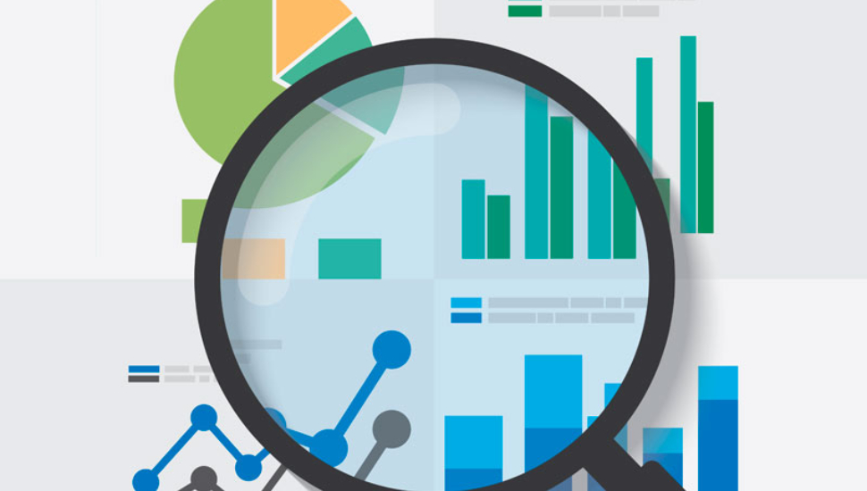 A graphic showing a magnifying glass looking at various business charts for reserach.