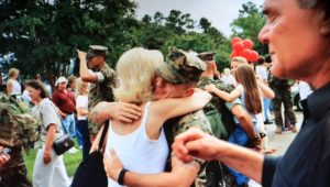 Marine Ryan Presutti hug his mother, Maryellen