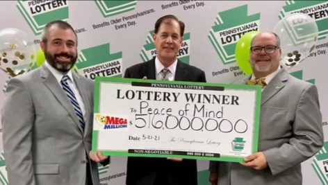 Attorneys for the Peace of Mind Trust pose with the Mega Millions check disbursement