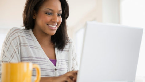 African American woman on computer.