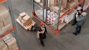 Overhead shot of inventory being moved in a warehouse