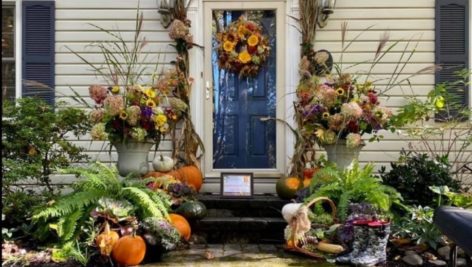 The front door of a home decorated for fall.