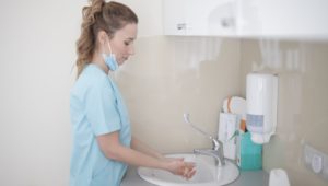 Nurse washing her hands.