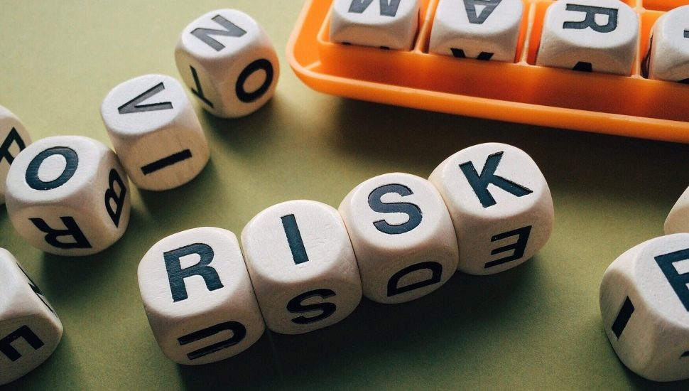 Letter game spelling out the word RISK