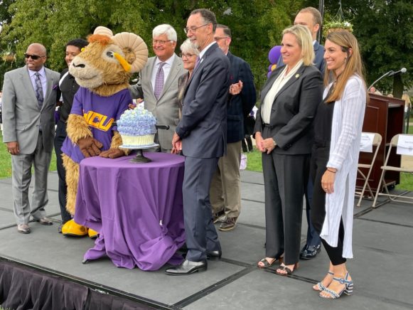 WCU Mascot Rammy cuts the official Anniversary Cupcake with President Fiorentino.