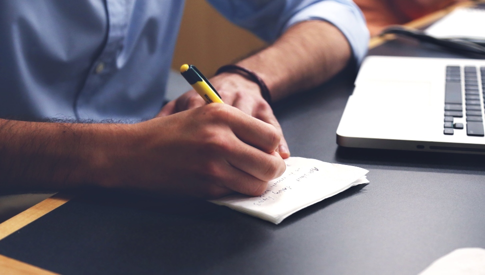 Man writing in a notebook