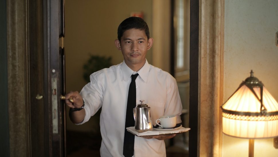 room service employee with coffee