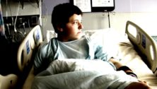 teenager in hospital bed