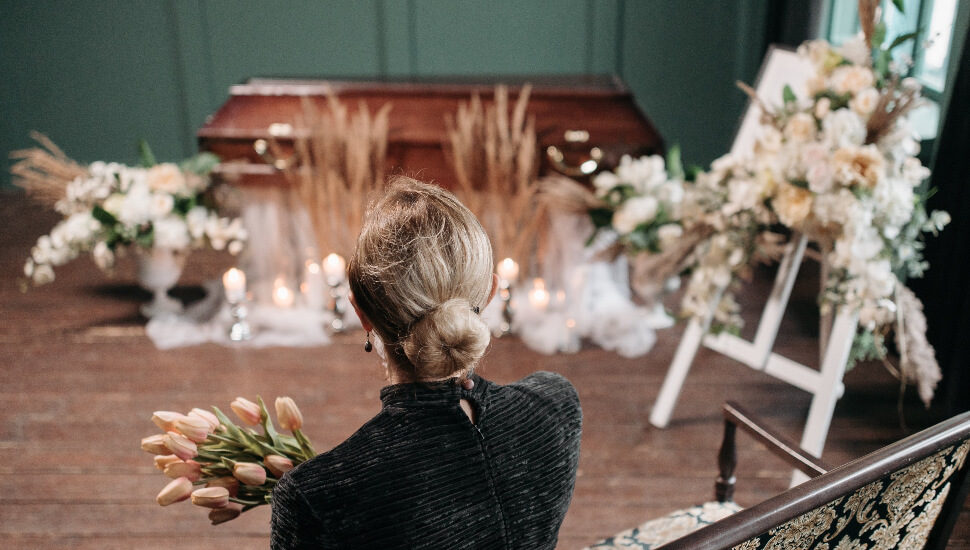 A woman mourns alone.