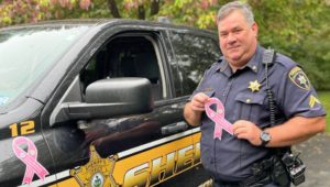 car with pink ribbon