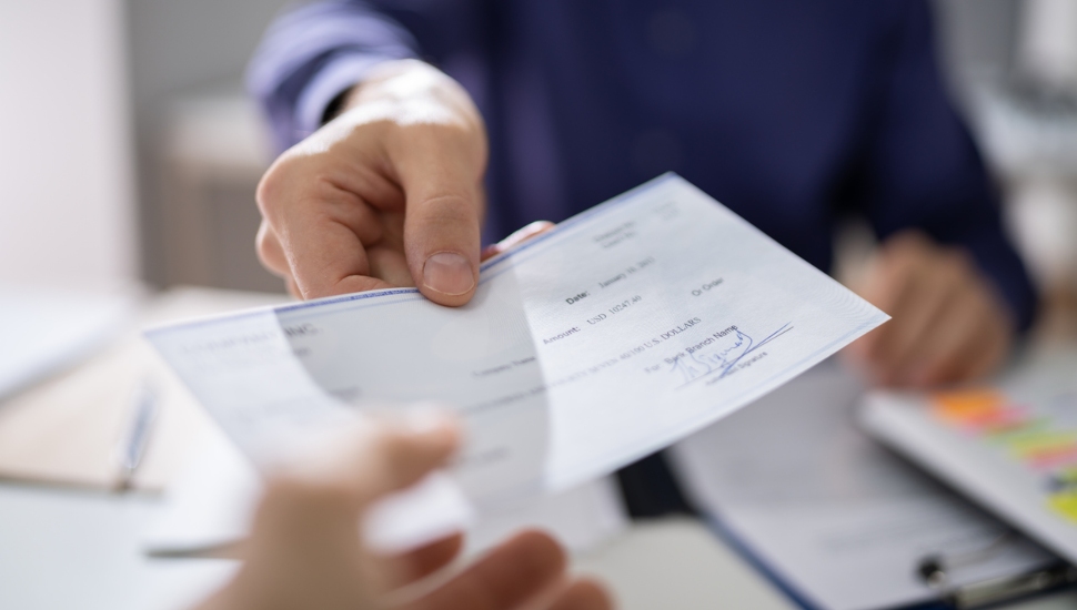 Man receiving his paycheck.