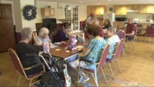 senior citizens around a table