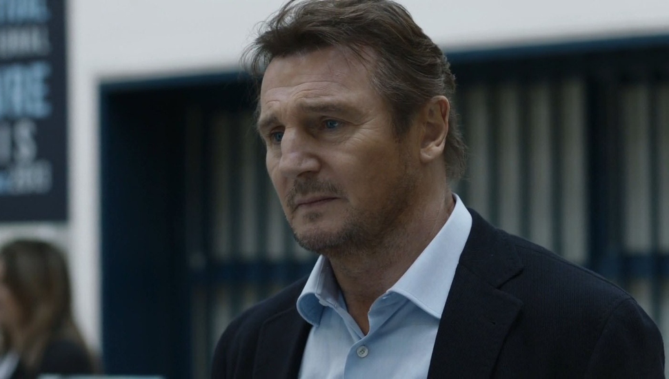 man with open collar and blue coat