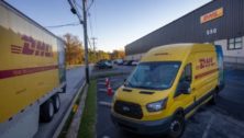 A DHL shipping truck is parked outside its new facility in Sharon Hill.