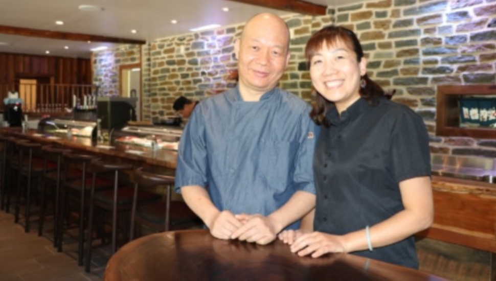 asian couple at a bar