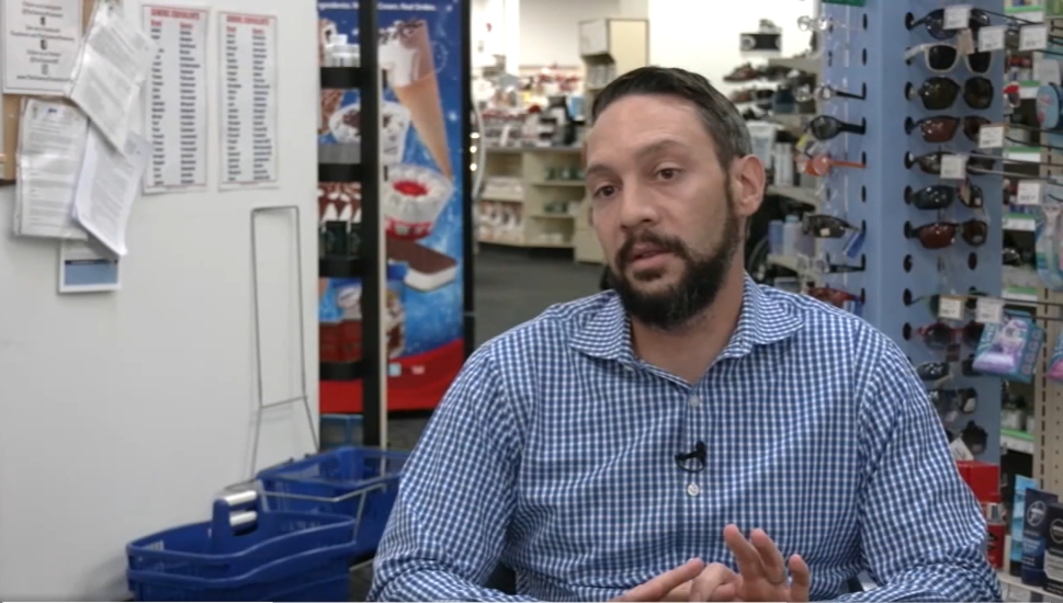 bearded man in blue-checked shirt
