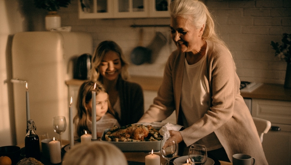 woman holding a pan with food