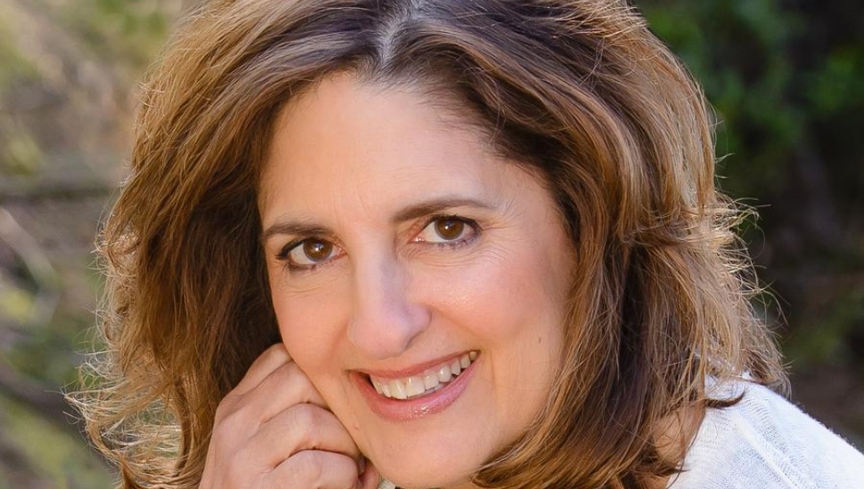 smiling woman with brown hair