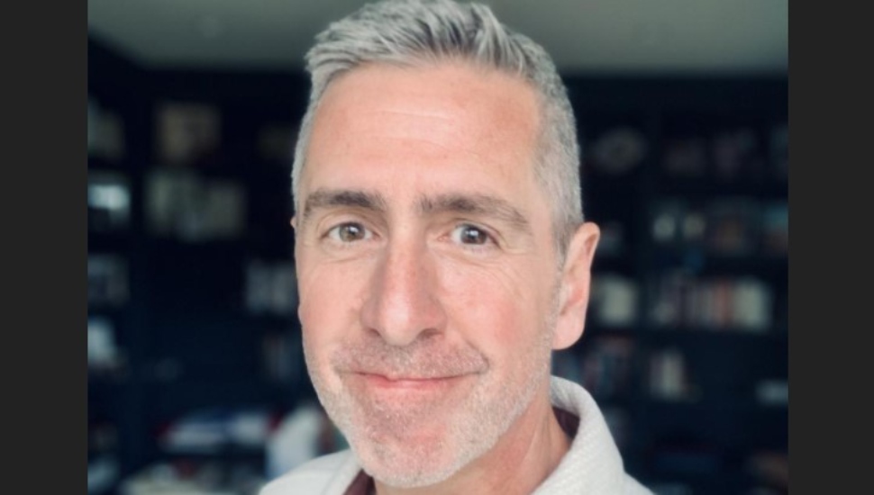 white-haired man in white shirt