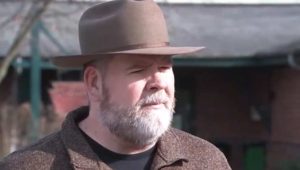 bearded man wearing a hat