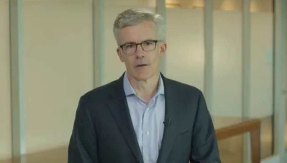 man in blue jacket and glasses