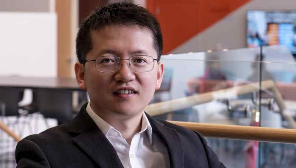 man with short hair and glasses