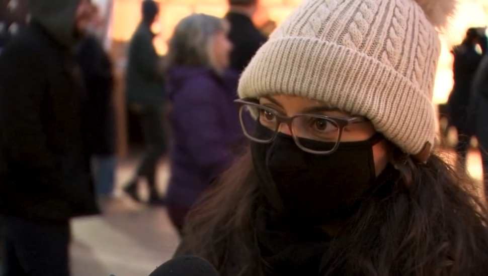 woman in white cap and black mask