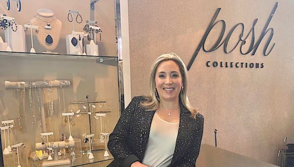 woman standing by jewelry display