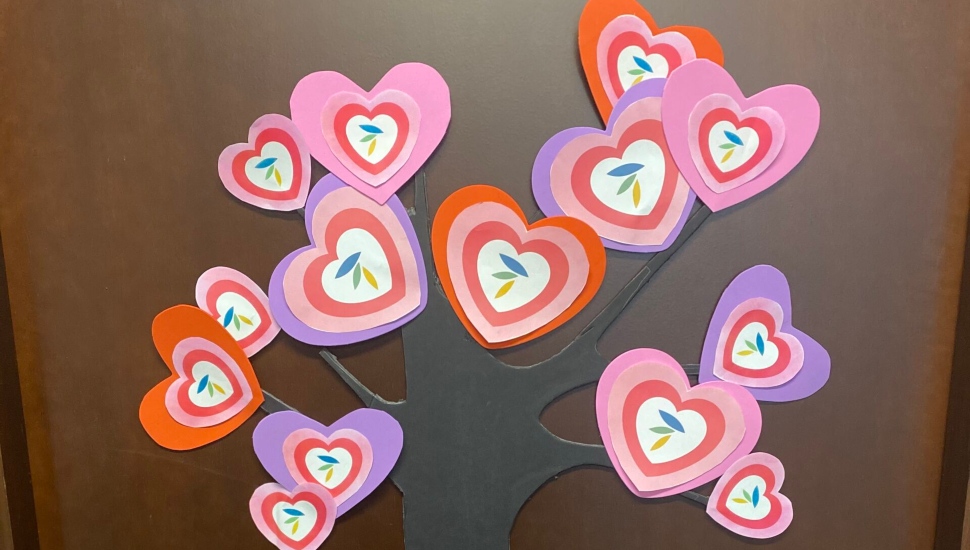 Paper heart decorations on a door.