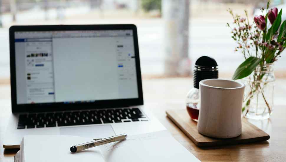 desk with computer and mug