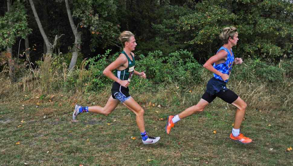 two runners on a trail