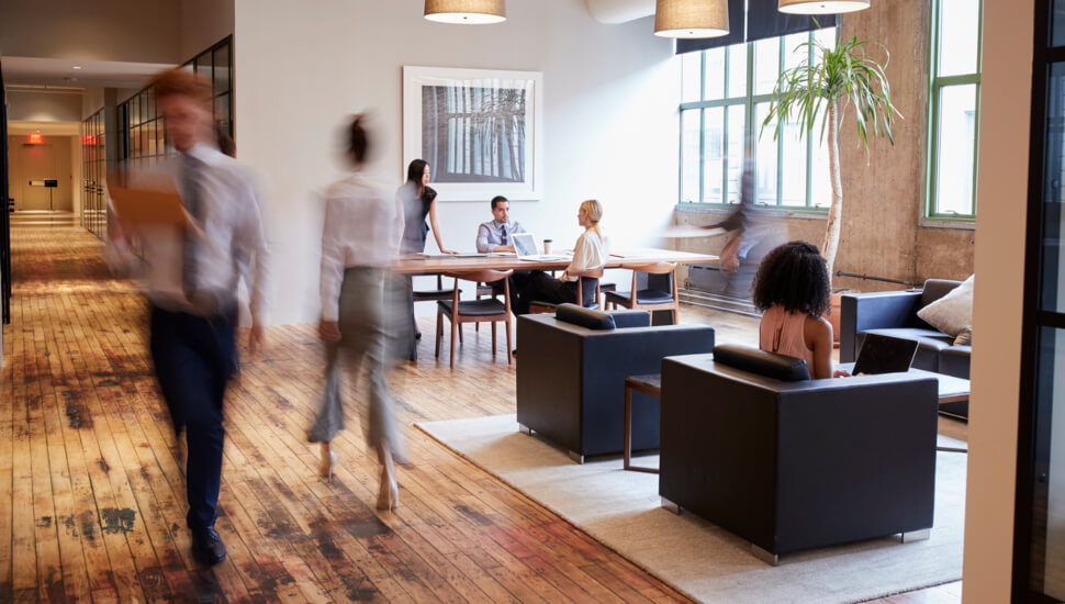 People walking in a building lobby