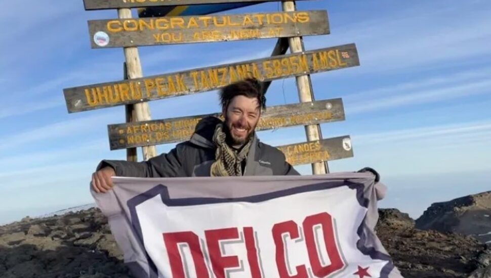 Roddie Cooper at the top of Mount Kilimanjaro.