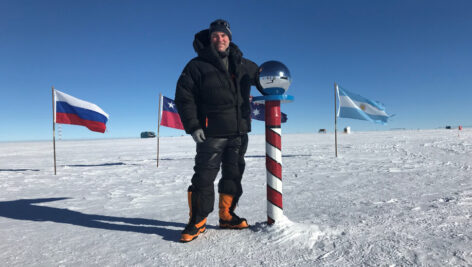 Chris Powell standing at the South Pole