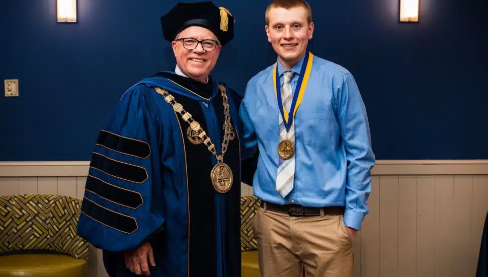 Jake Loburak with Neumann University President Dr. Chris Domes.